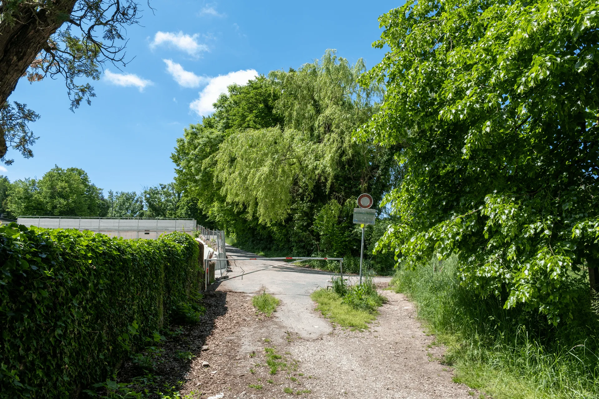 "A gate marking the border between France and Switzerland"
