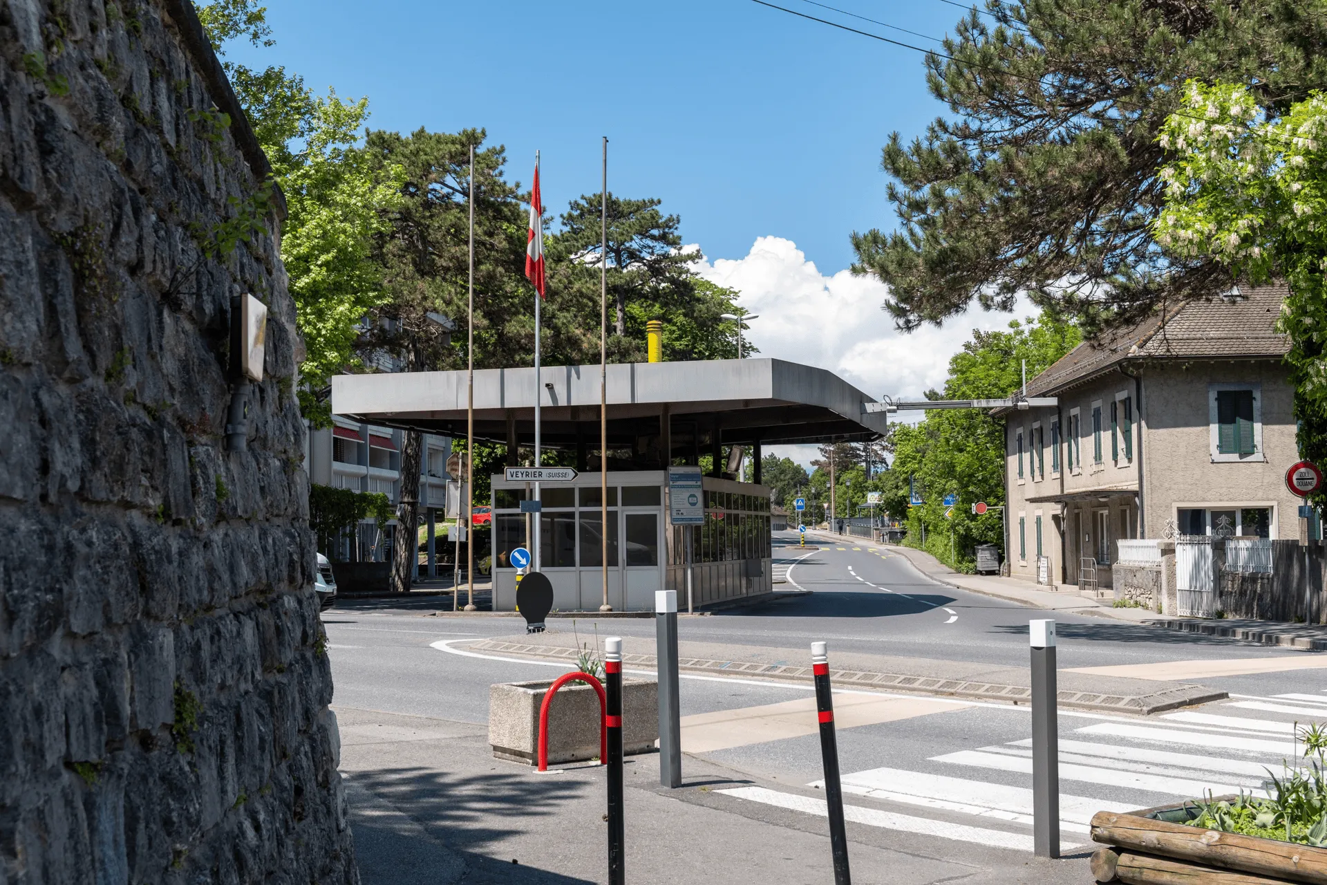 "A border checkpoint building between France and Switzerland"