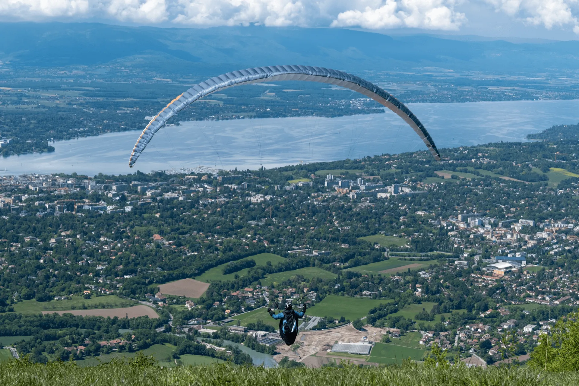 "A paraglider taking off from the summit"