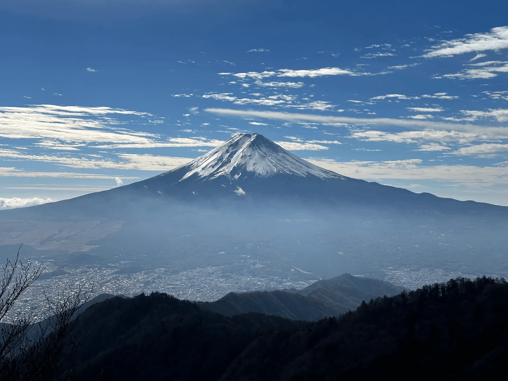 A clear, if slightly overcast, shot of Mt Fuji capped in snow.