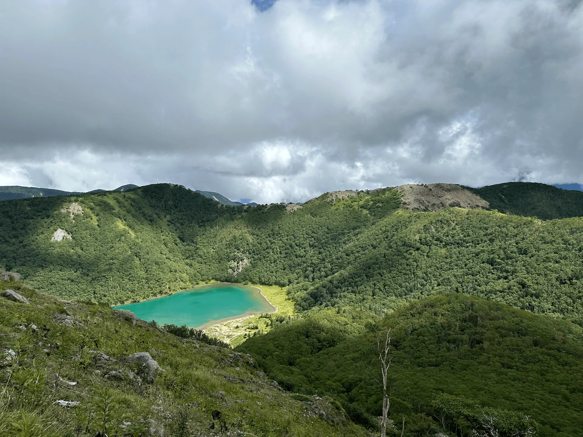 "View of the lake from a different angle during the final climb"